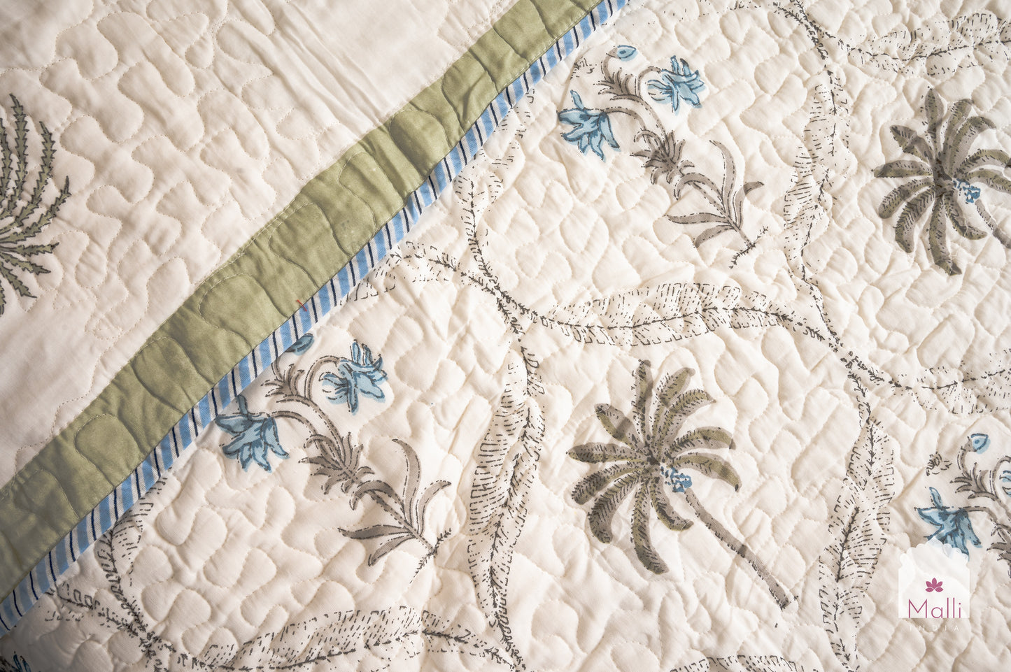 Tulip jaal with marigolds - Quilted reversible bedcover in pure mulmul cotton