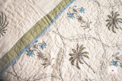 Tulip jaal with marigolds - Quilted reversible bedcover in pure mulmul cotton