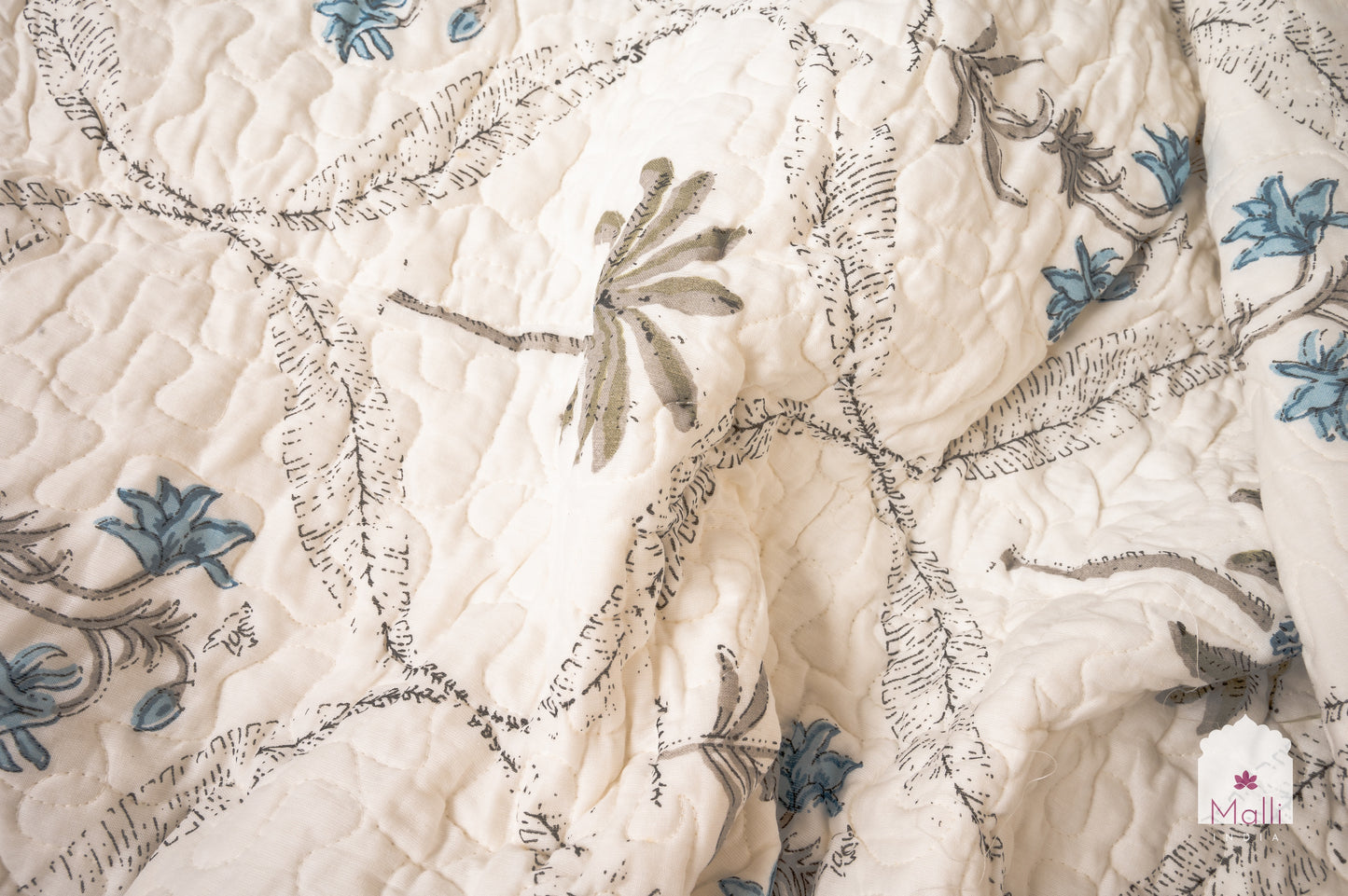 Tulip jaal with marigolds - Quilted reversible bedcover in pure mulmul cotton