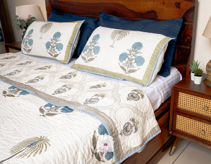 Marigold, palm and sunflower jaal - Quilted reversible bedcover in pure mulmul cotton