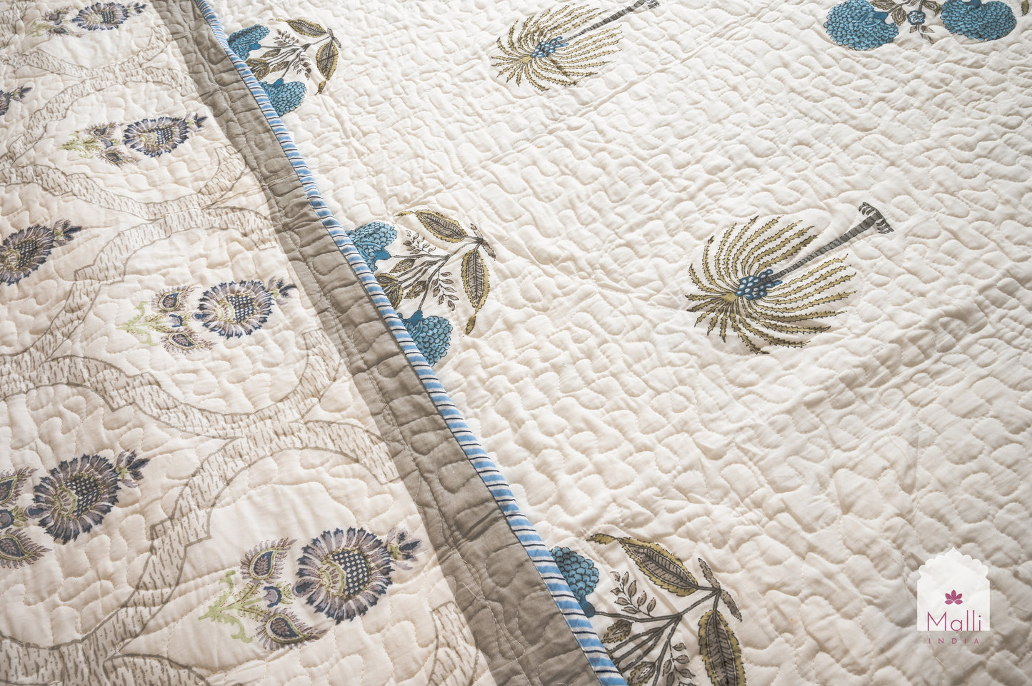 Marigold, palm and sunflower jaal - Quilted reversible bedcover in pure mulmul cotton