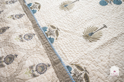 Marigold, palm and sunflower jaal - Quilted reversible bedcover in pure mulmul cotton