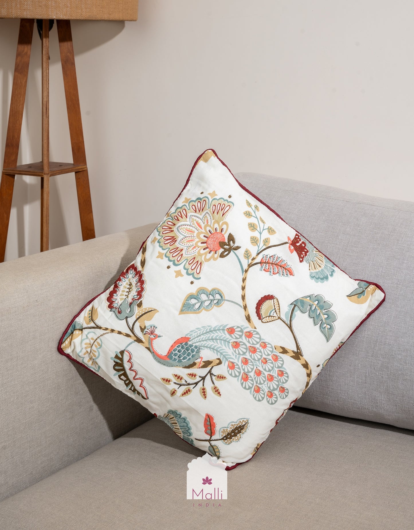 Peacock in a garden on cream base  - Cushion cover