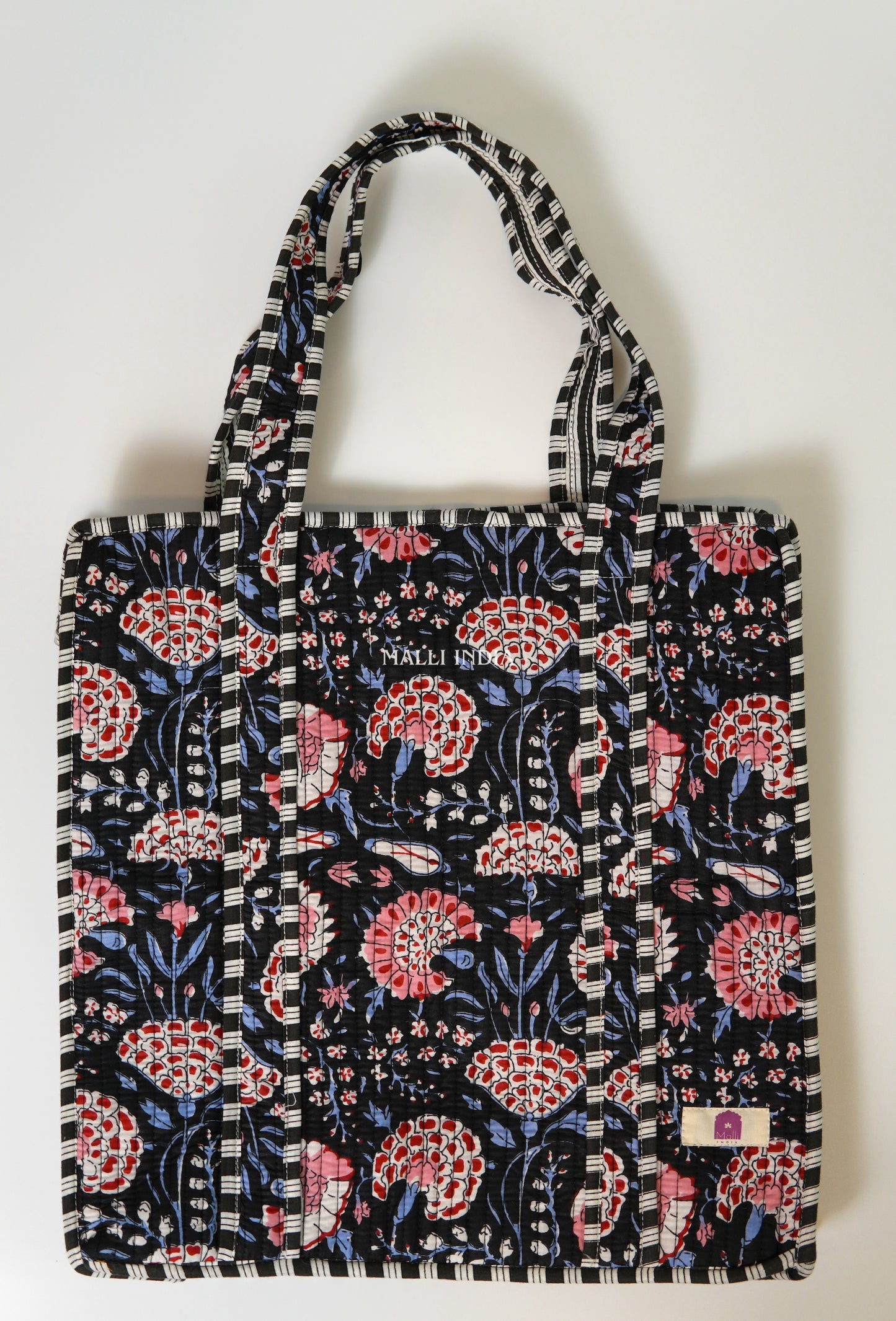 Travel tote bag with zipper closure - Red & blue florals on black in gadh print