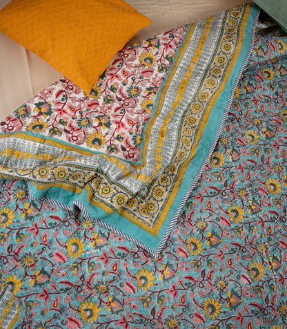 Orchard on blue - Handblock printed pure mulmul cotton reversible quilt
